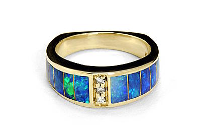 a gold ring with opal and diamonds