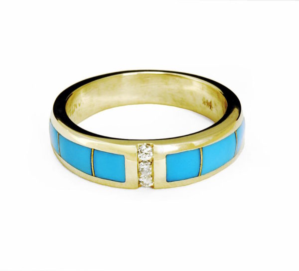 close up of gold and turquoise ring
