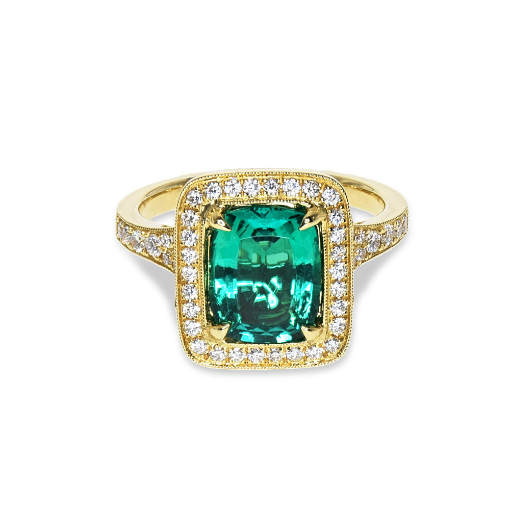 A gold ring with a large emerald and diamonds A gold ring featuring emerald and diamonds