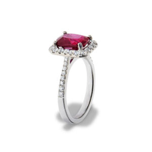 A white gold ring featuring a ruby gemstone and diamondsruby ring