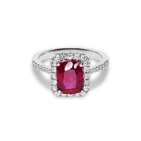A white gold ring with a ruby and small diamonds