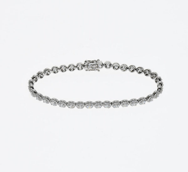 a white gold link style bracelet with over 500 diamonds