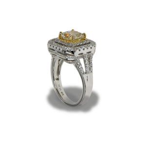 Gold ring with many small diamonds and a large center diamond