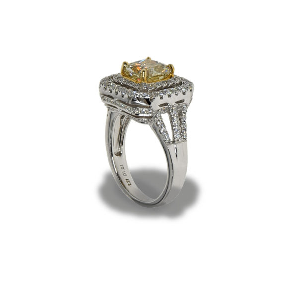 Gold ring with many small diamonds and a large center diamond